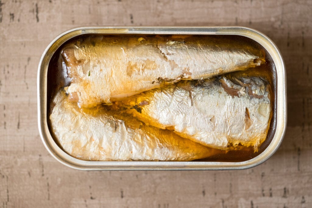 tinned sardines can be a wonderful addition to a puppy's meal! They can really help add in good, healthy oils - and they taste great too!