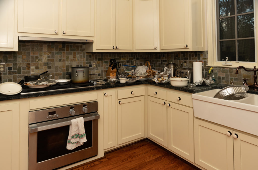 a typical messy kitchen after cooking a christmas dinner, but this is a counter surfing dog's dream - there's something edible up there somewhere...
